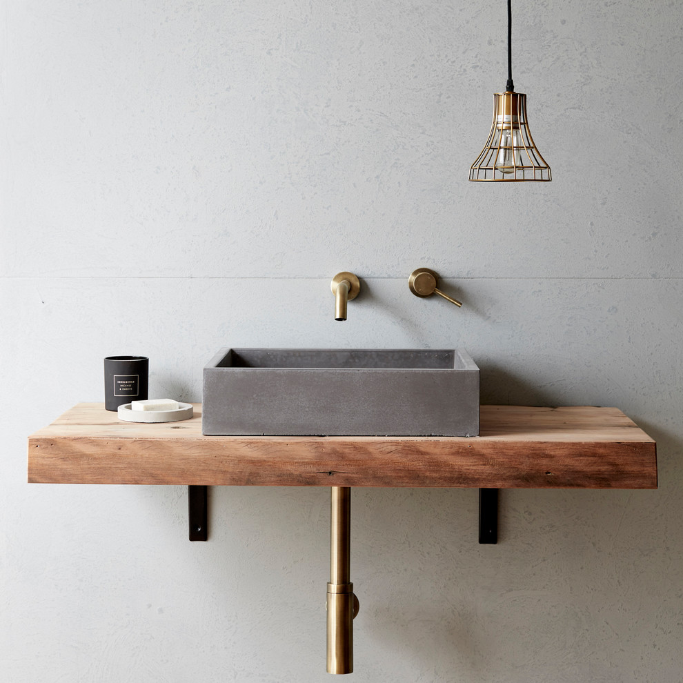 Inspiration for an industrial bathroom in Gold Coast - Tweed with flat-panel cabinets, medium wood cabinets, grey walls, a vessel sink and wood benchtops.