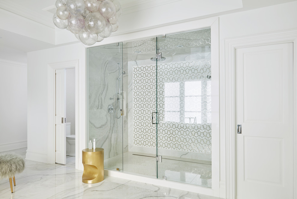 Inspiration for a large transitional master bathroom in Toronto with recessed-panel cabinets, white cabinets, a freestanding tub, a double shower, a one-piece toilet, multi-coloured tile, marble, white walls, porcelain floors, engineered quartz benchtops, multi-coloured floor, a hinged shower door and white benchtops.