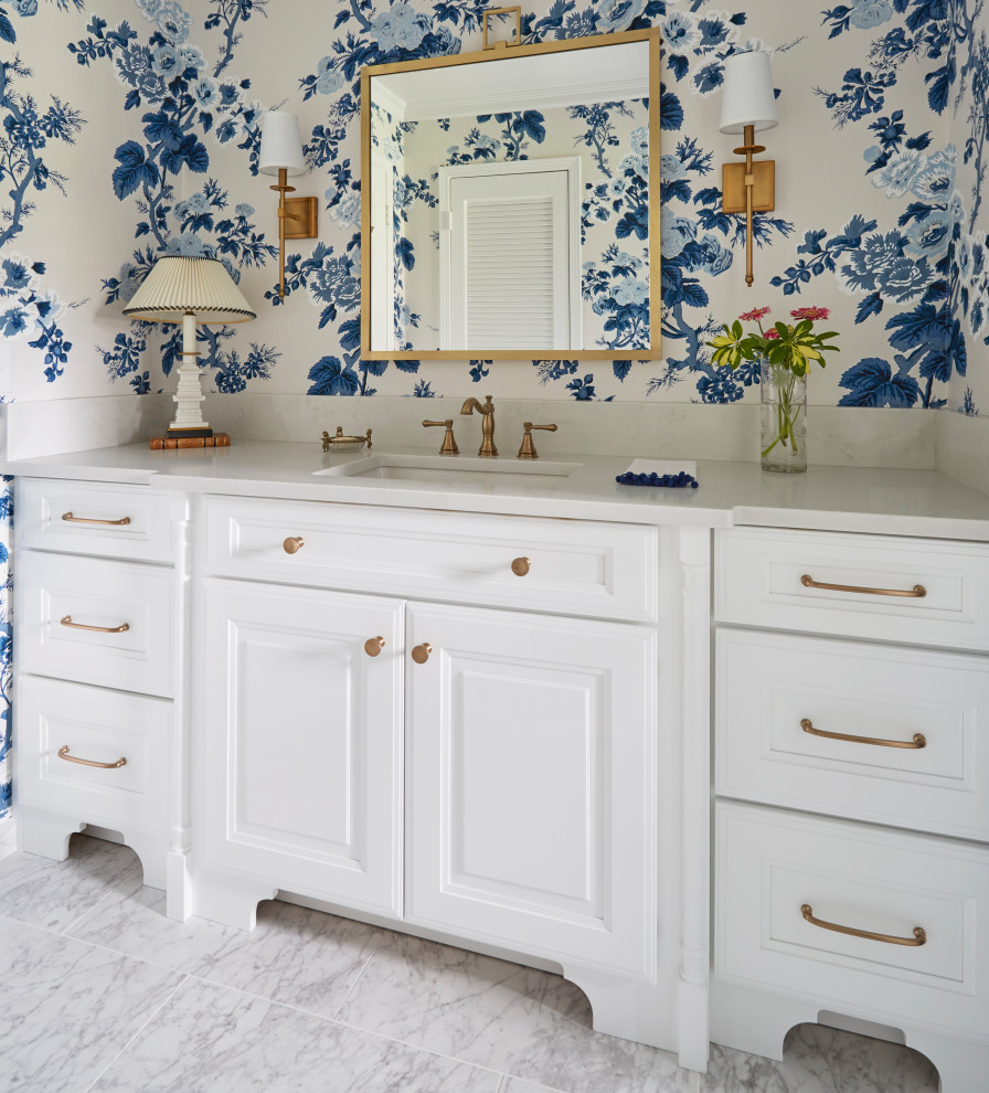 Inspiration for a mid-sized traditional bathroom in Jacksonville with furniture-like cabinets, white cabinets, an alcove tub, an alcove shower, a two-piece toilet, white tile, porcelain tile, white walls, porcelain floors, an undermount sink, engineered quartz benchtops, white floor, a shower curtain and white benchtops.