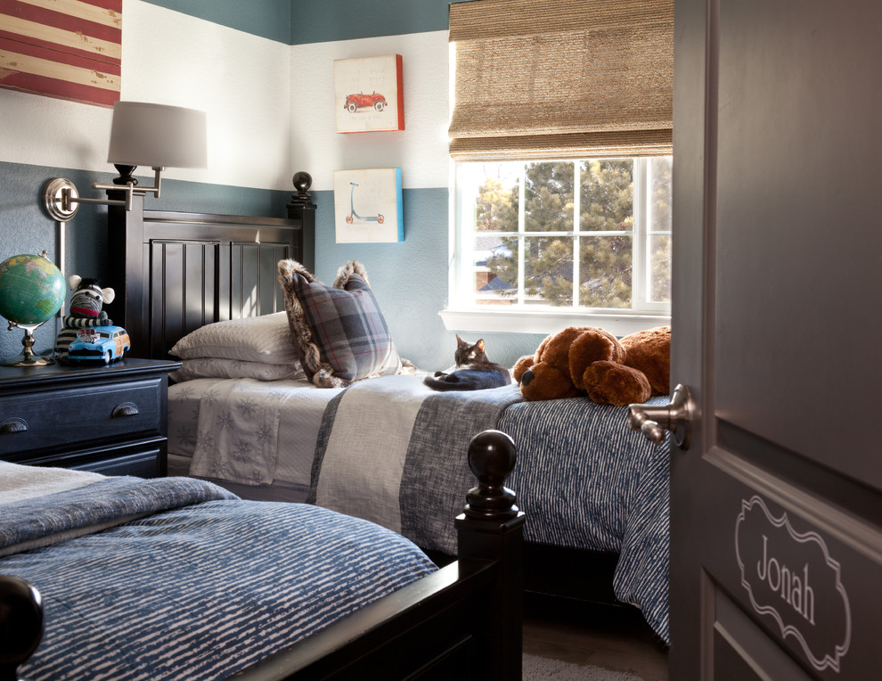 This is an example of a mid-sized transitional kids' bedroom for kids 4-10 years old and boys in Denver with blue walls, light hardwood floors and beige floor.