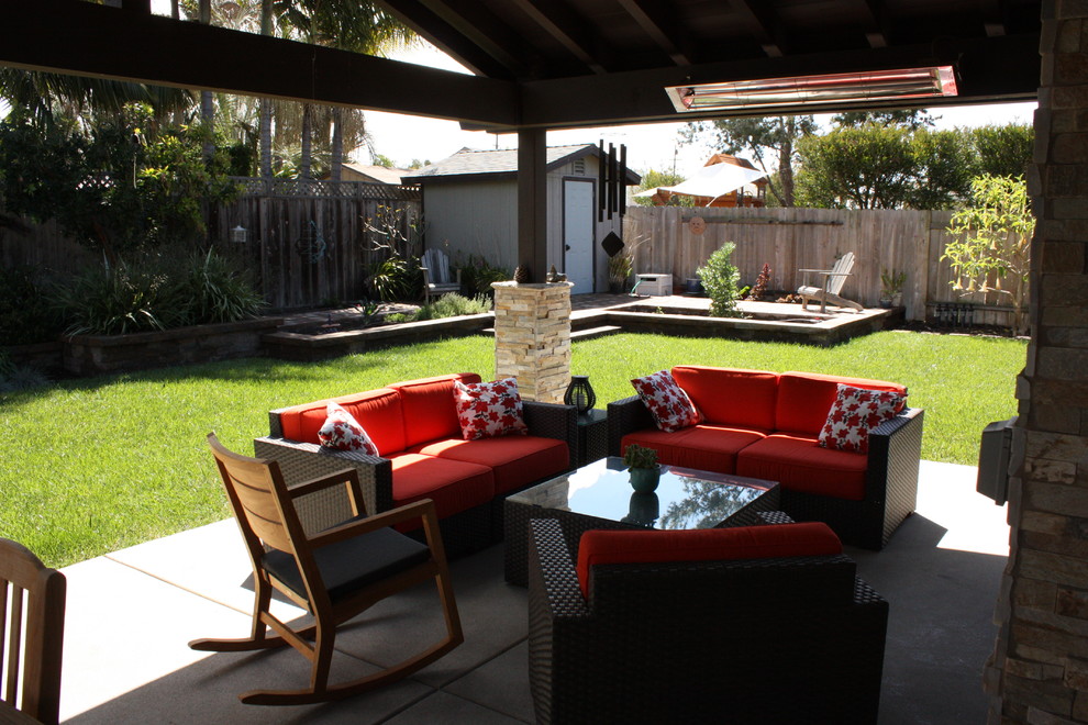 Design ideas for a contemporary backyard patio in San Diego with concrete slab and a roof extension.