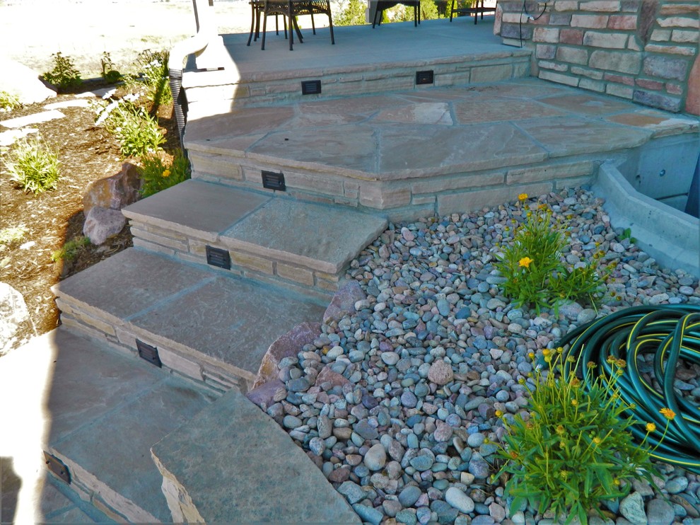 Photo of a mid-sized contemporary backyard garden in Denver with with path and natural stone pavers.