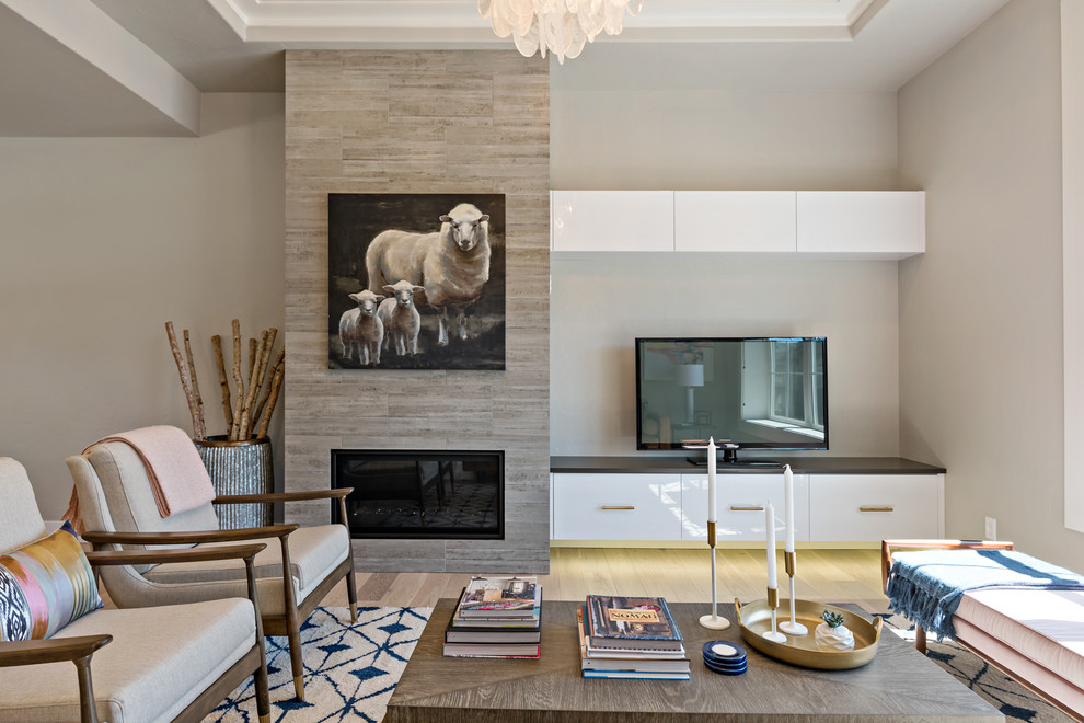 Inspiration for a transitional formal living room in Boise with grey walls, light hardwood floors, a ribbon fireplace, a freestanding tv and beige floor.