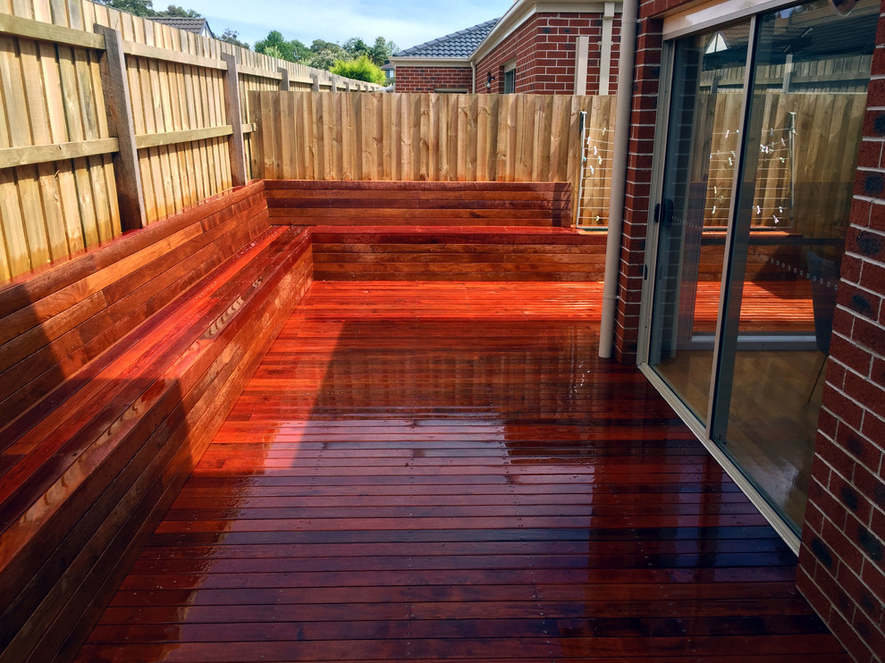 Photo of a large modern backyard deck in Melbourne with an awning.
