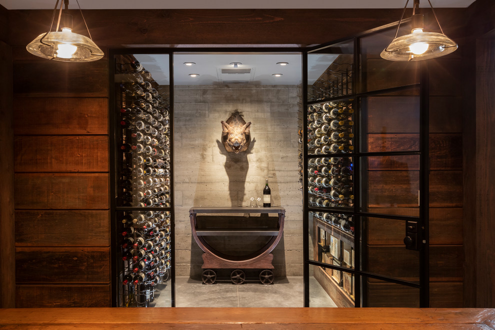 Design ideas for a mid-sized traditional wine cellar in San Francisco with concrete floors, storage racks and grey floor.