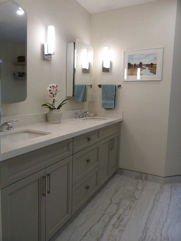Photo of a mid-sized contemporary master bathroom in Vancouver with shaker cabinets, grey cabinets, beige walls, ceramic floors, an undermount sink, engineered quartz benchtops, grey floor, white benchtops, a shower seat, a double vanity and a built-in vanity.