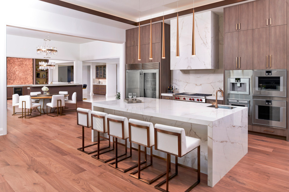 Example of a huge transitional l-shaped light wood floor and brown floor eat-in kitchen design in Detroit with a farmhouse sink, flat-panel cabinets, dark wood cabinets, quartzite countertops, white backsplash, quartz backsplash, stainless steel appliances, an island and white countertops