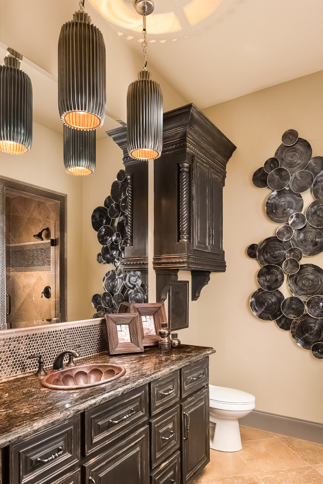 Design ideas for a mid-sized master bathroom in Dallas with raised-panel cabinets, distressed cabinets, a corner shower, a two-piece toilet, beige tile, ceramic tile, beige walls, porcelain floors, a drop-in sink, granite benchtops, beige floor, a hinged shower door and brown benchtops.