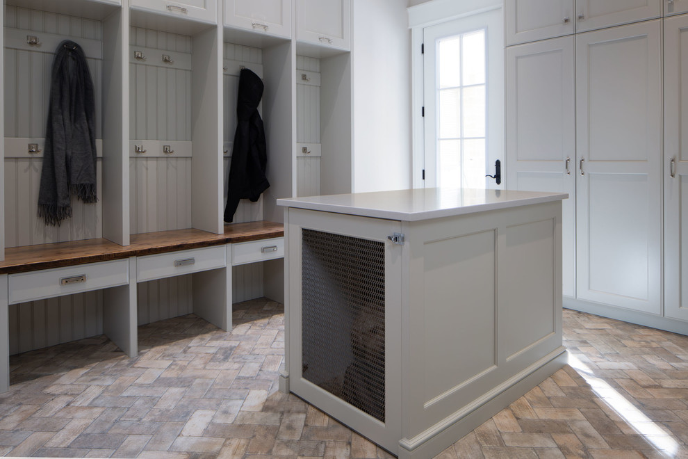 Photo of a large arts and crafts mudroom in Toronto with white walls, vinyl floors, a single front door, a glass front door and multi-coloured floor.