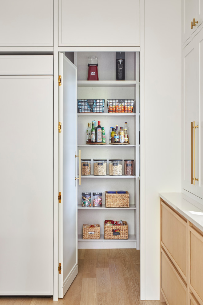 Kitchen pantry - transitional galley light wood floor kitchen pantry idea in Ottawa with a farmhouse sink, shaker cabinets, white cabinets, marble countertops, multicolored backsplash, marble backsplash, paneled appliances, an island and multicolored countertops