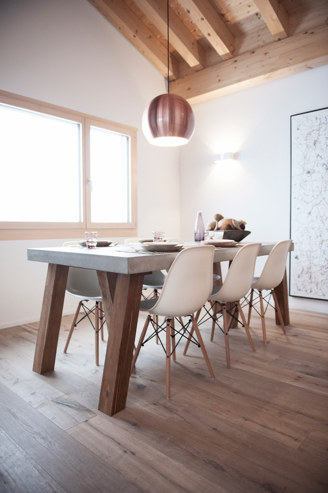 Example of a small mountain style light wood floor kitchen/dining room combo design with white walls