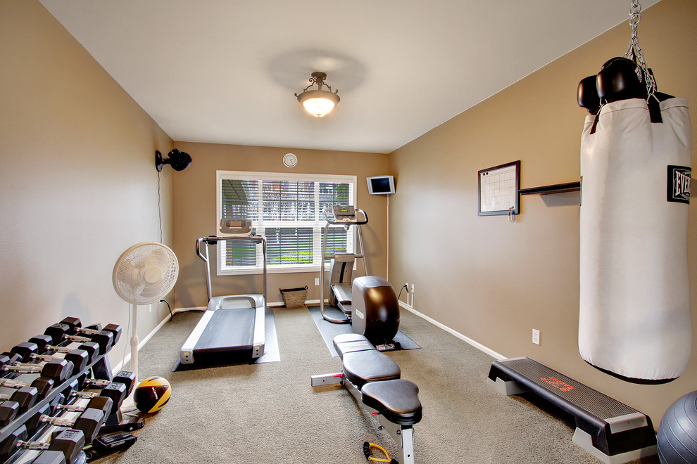 Inspiration for a traditional multipurpose gym in Austin with beige walls, carpet and beige floor.
