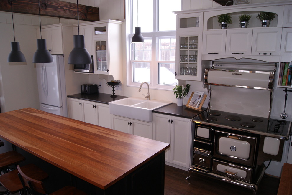 This is an example of a country single-wall open plan kitchen in Montreal.