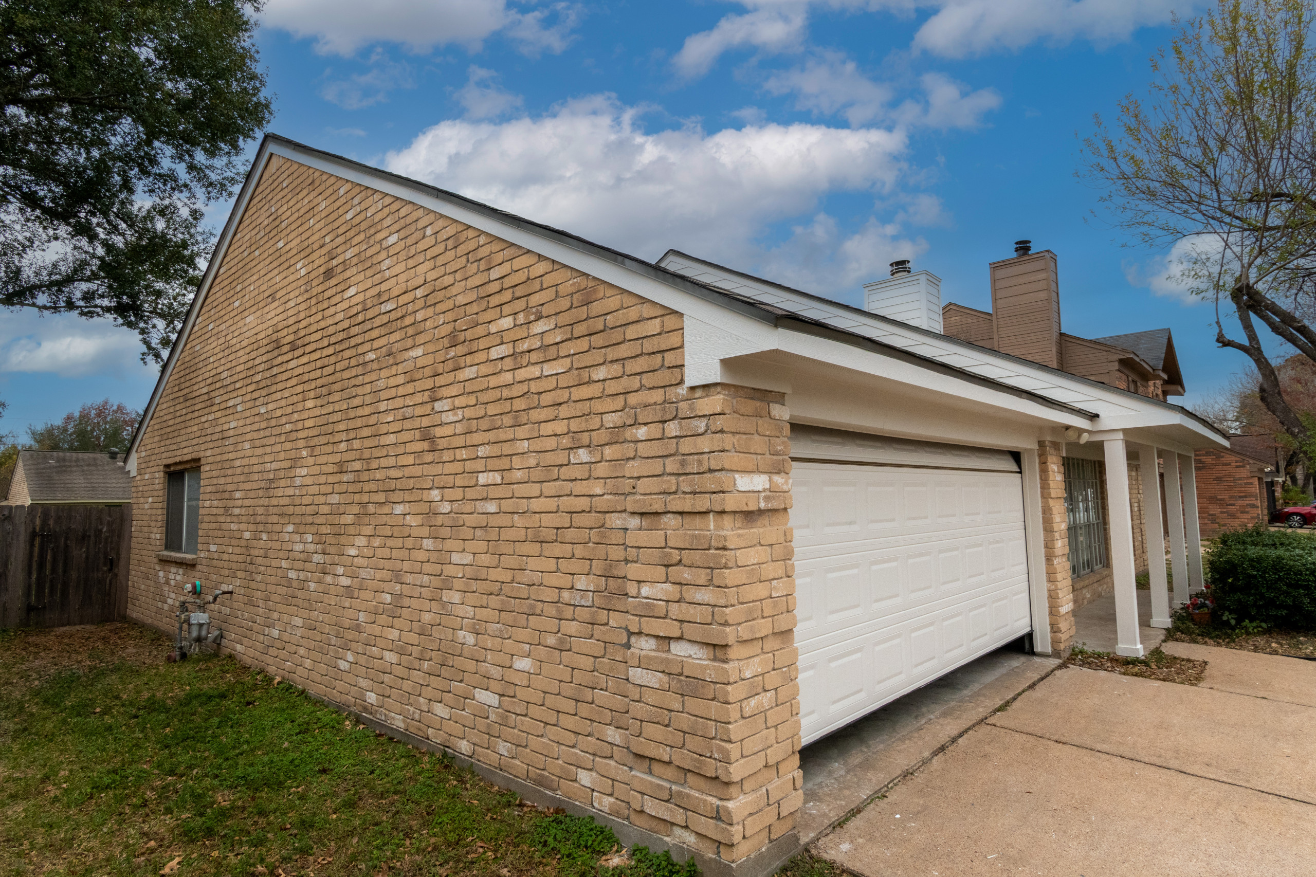 Brick Home Refresh with Hardie Siding, Fascia, Soffit, and Modern Column Replace