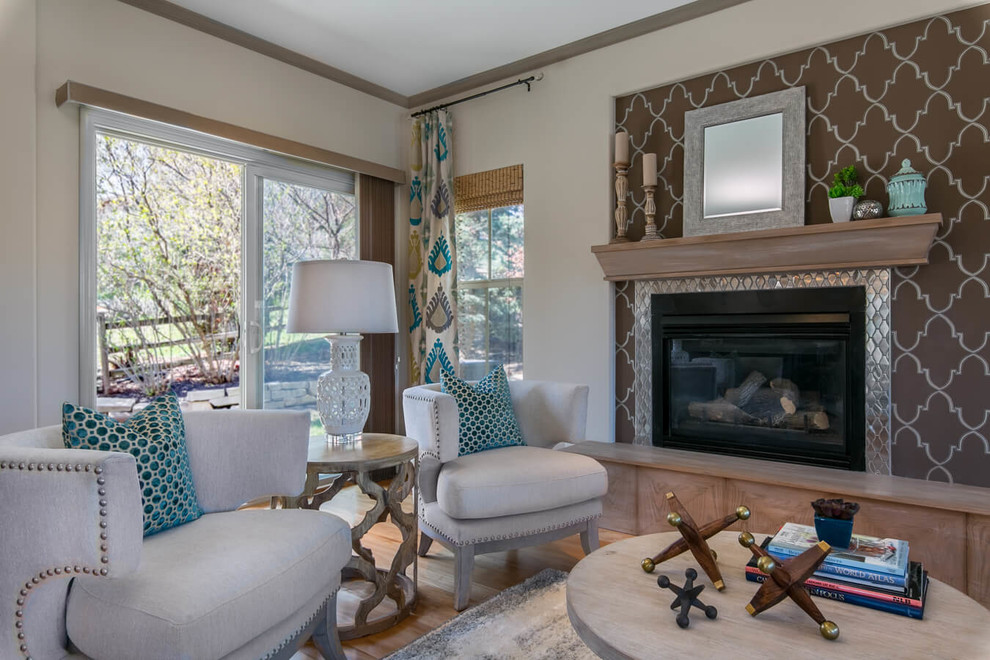 Inspiration for a mid-sized transitional open concept family room in Boise with beige walls, medium hardwood floors, a standard fireplace and a tile fireplace surround.