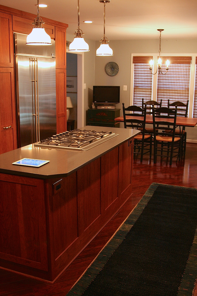 Example of a transitional laminate floor kitchen design in DC Metro with shaker cabinets, quartz countertops, blue backsplash and porcelain backsplash