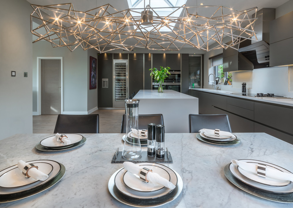Inspiration for a contemporary kitchen/dining combo in Hertfordshire with grey walls.