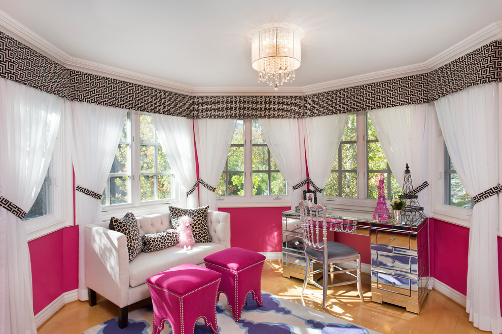 Mid-sized eclectic master bedroom in Los Angeles with pink walls and light hardwood floors.