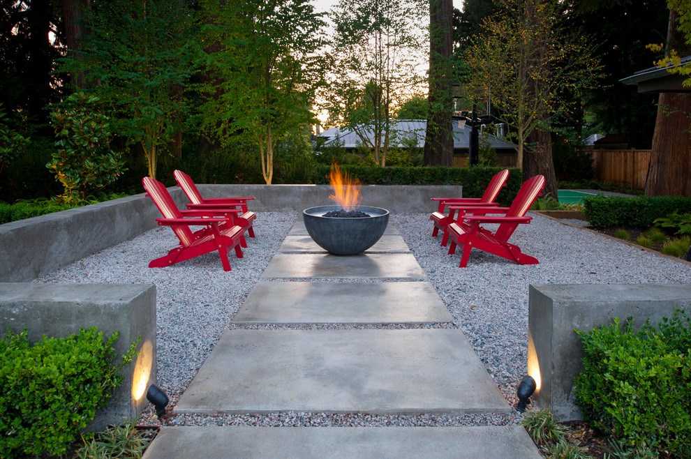 Photo of a contemporary backyard patio in Vancouver with a fire feature.