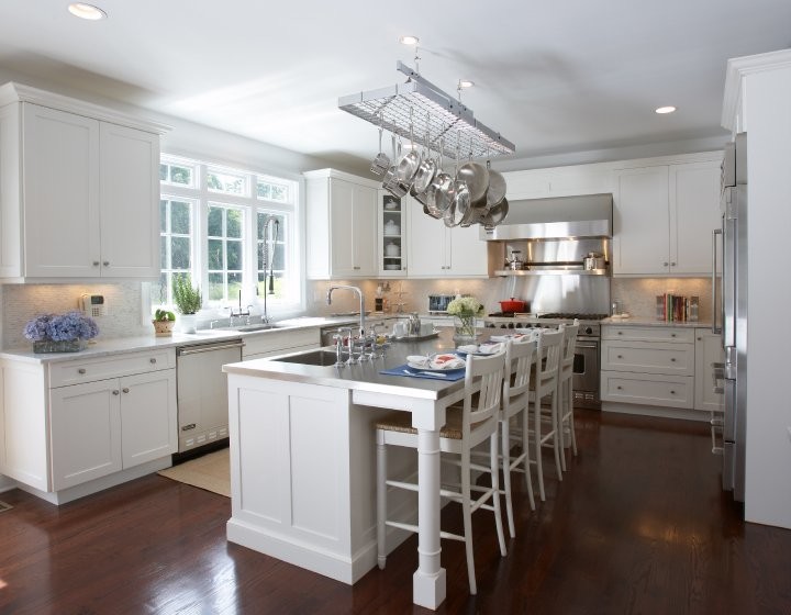 Large transitional u-shaped dark wood floor eat-in kitchen photo with shaker cabinets, white cabinets, stainless steel countertops, white backsplash, stainless steel appliances and an island