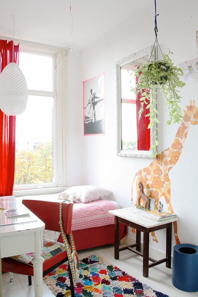 This is an example of a scandinavian kids' study room for girls in Amsterdam with white walls and white floor.