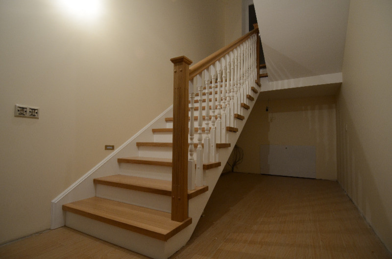 Wood cladding of a concrete stair