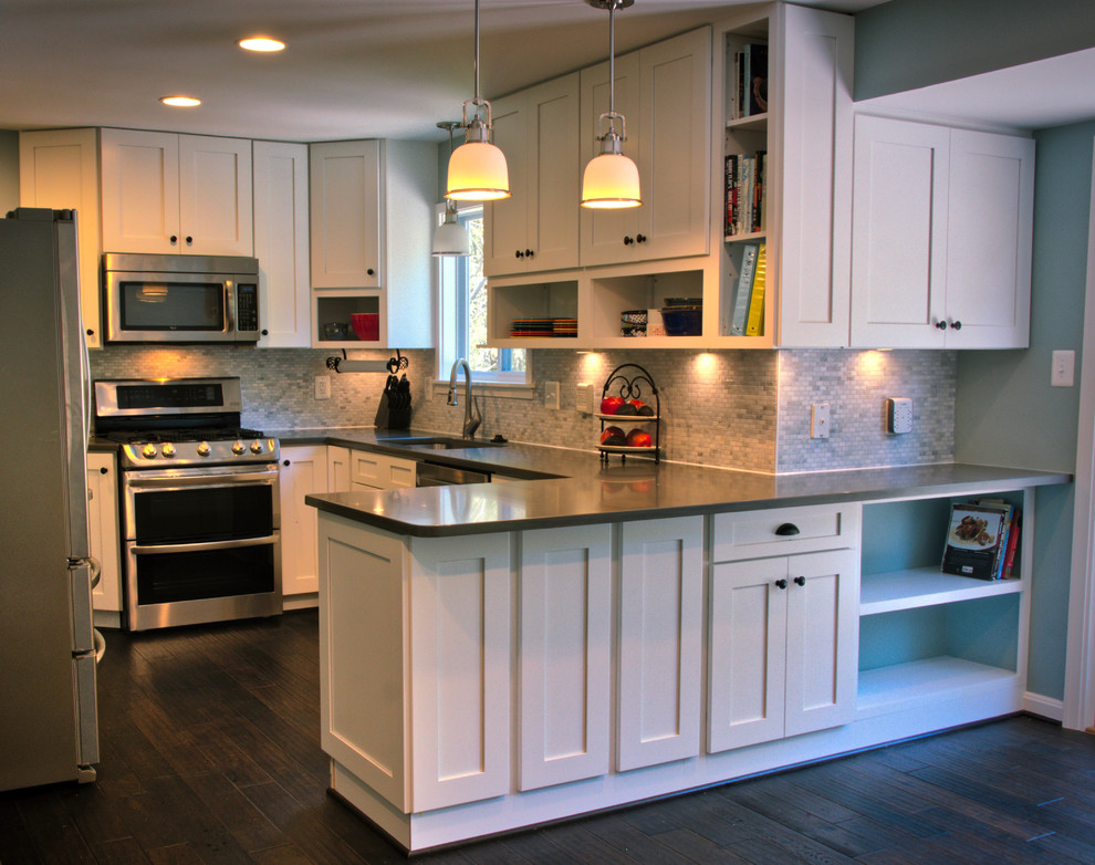 Kitchen - mid-sized transitional u-shaped dark wood floor and brown floor kitchen idea in DC Metro with an undermount sink, shaker cabinets, white cabinets, quartz countertops, gray backsplash, matchstick tile backsplash, stainless steel appliances and a peninsula