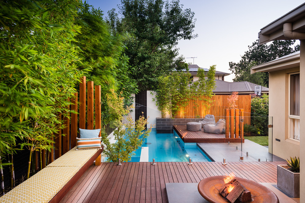 Design ideas for a contemporary backyard rectangular pool in Melbourne with decking.