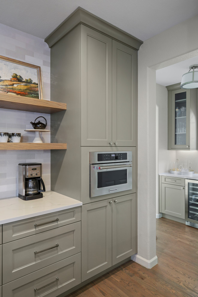 Example of a transitional kitchen design in Denver