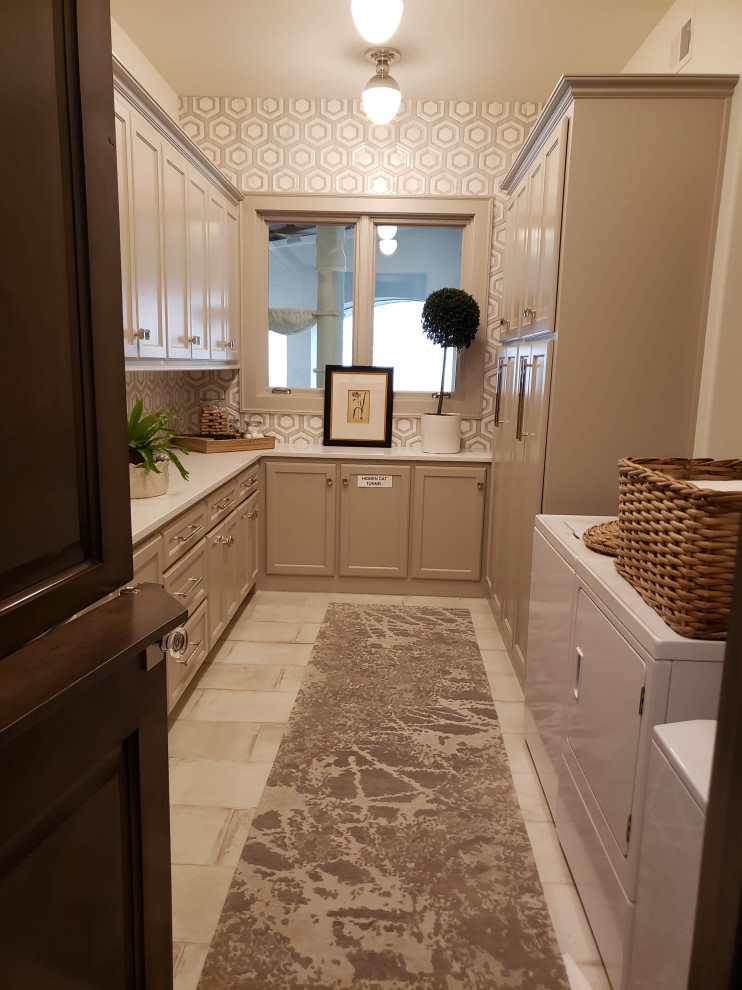 Design ideas for a large mediterranean l-shaped utility room in Kansas City with shaker cabinets, grey cabinets, marble benchtops, grey splashback, ceramic splashback, grey walls, a side-by-side washer and dryer, beige floor and white benchtop.