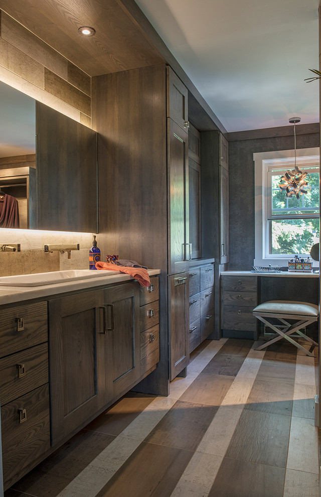 Inspiration for a large country master bathroom in Other with shaker cabinets, dark wood cabinets, beige tile, medium hardwood floors, a drop-in sink and brown floor.