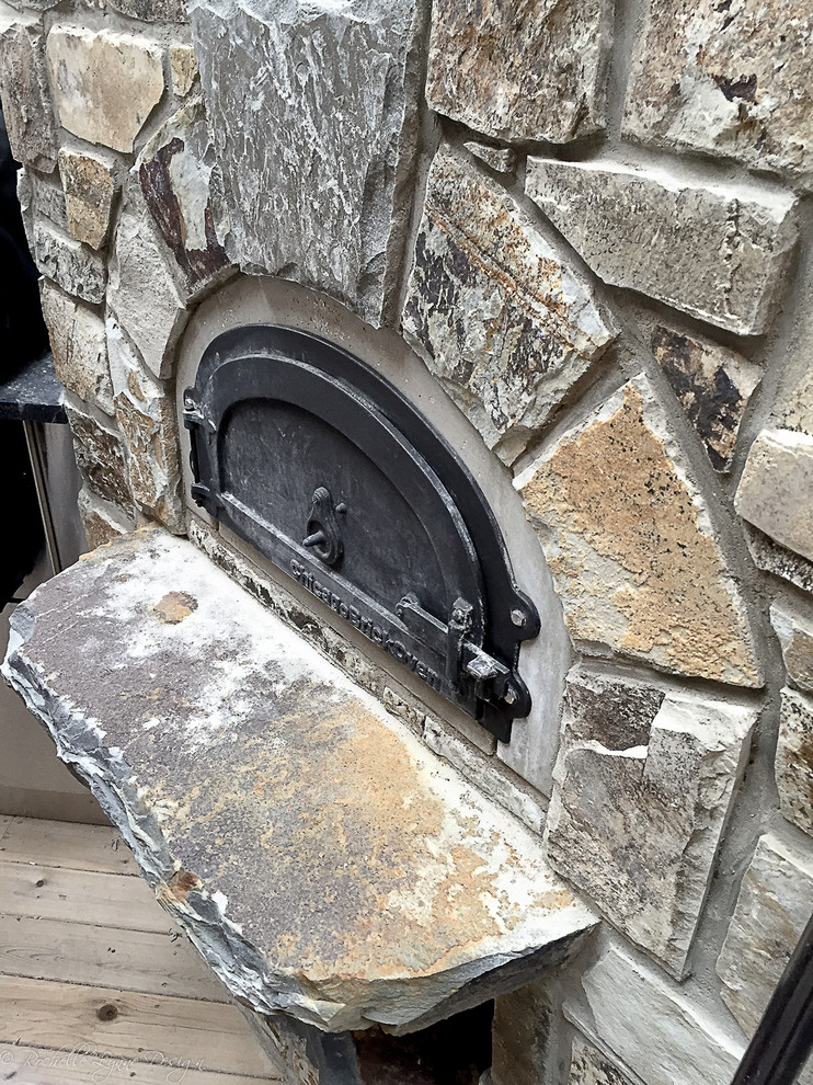 Inspiration for a rustic side yard outdoor kitchen deck remodel in Calgary