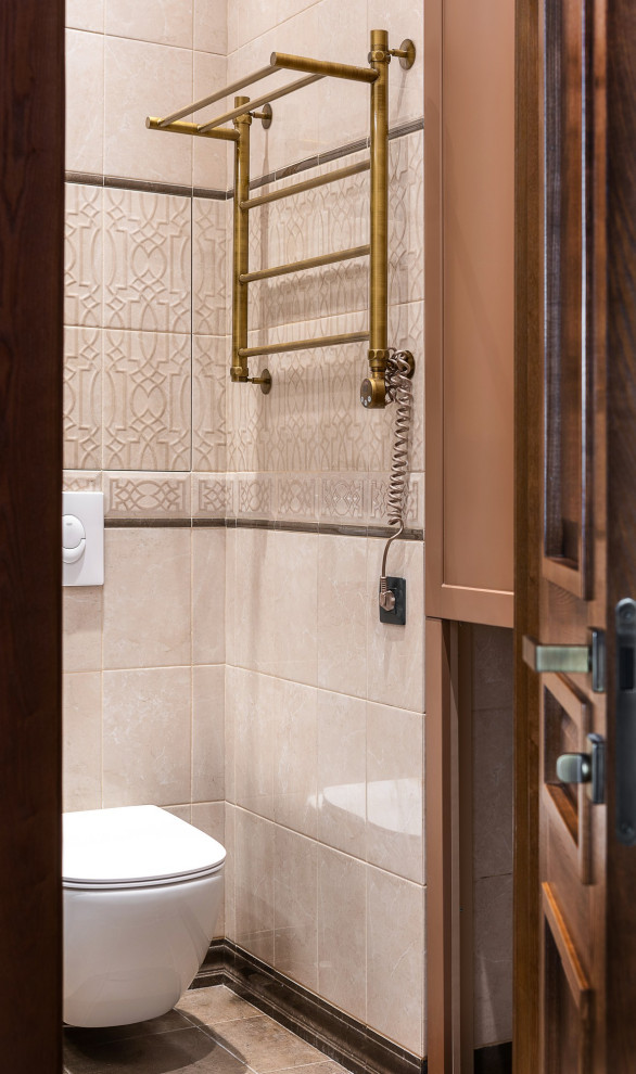 This is an example of a mid-sized midcentury 3/4 bathroom in Other with recessed-panel cabinets, brown cabinets, a corner shower, a wall-mount toilet, beige tile, ceramic tile, beige walls, ceramic floors, an integrated sink, solid surface benchtops, brown floor, a sliding shower screen, white benchtops, a single vanity, a floating vanity and decorative wall panelling.