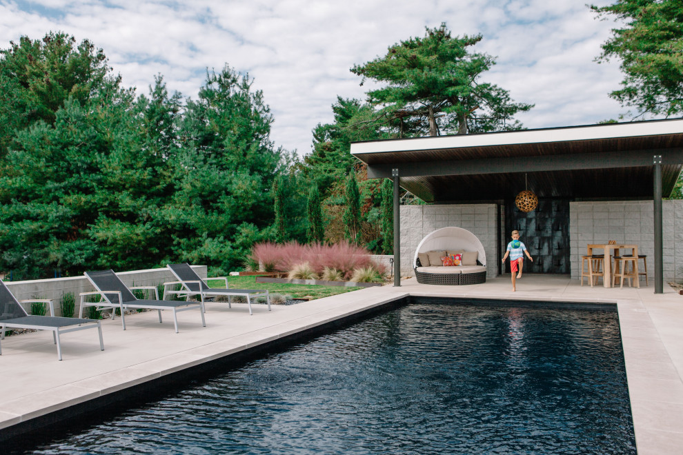 Design ideas for a modern swimming pool in Nashville with a shelter.