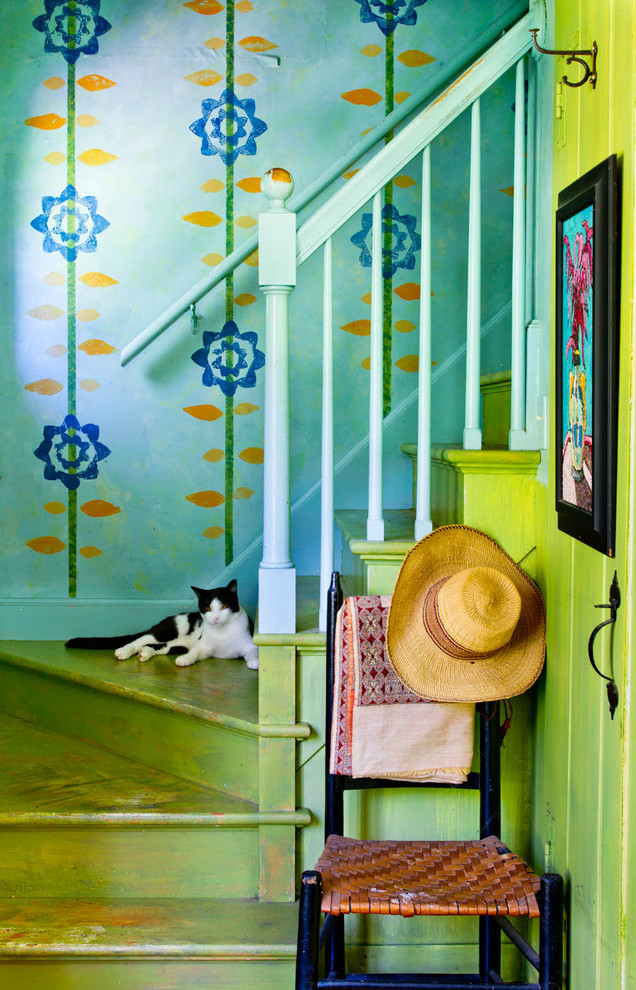 Country painted wood staircase in New York with painted wood risers.