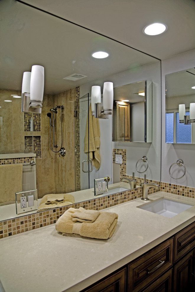 Mid-sized contemporary 3/4 bathroom in Los Angeles with mosaic tile, medium wood cabinets, a corner shower, a one-piece toilet, beige tile, grey walls, porcelain floors, an undermount sink, engineered quartz benchtops and recessed-panel cabinets.