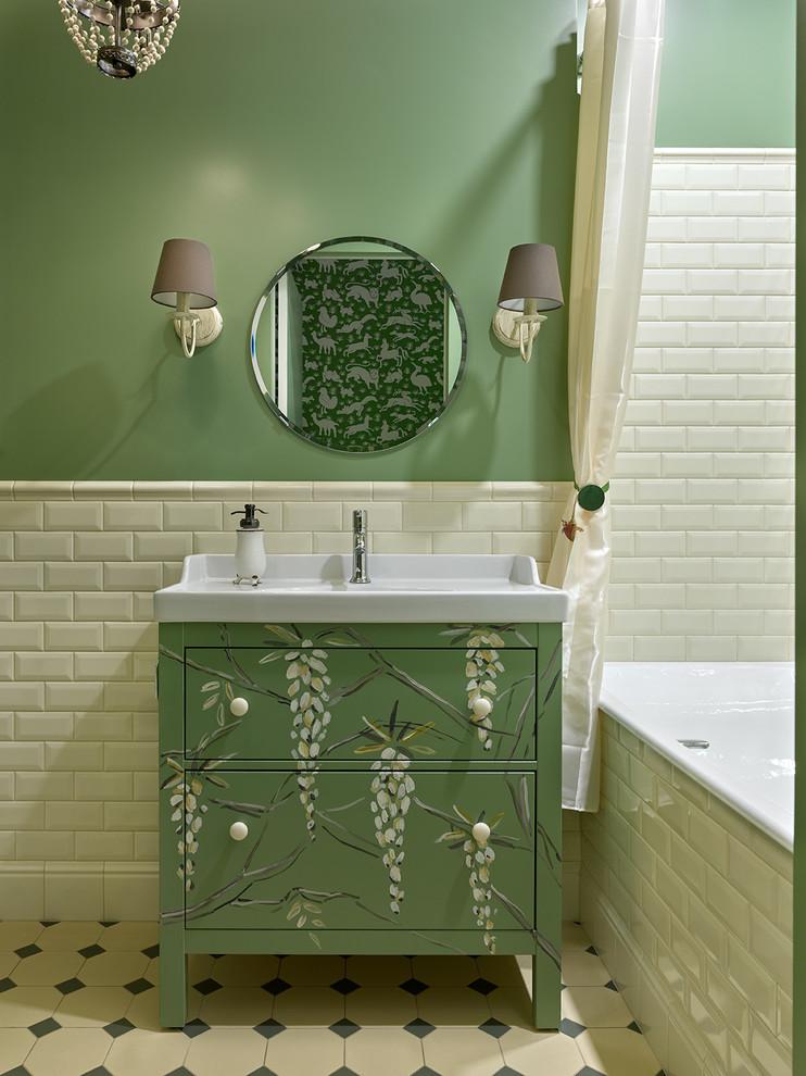 Photo of a transitional master bathroom in Moscow with flat-panel cabinets, green cabinets, an alcove tub, white tile, subway tile, green walls, an integrated sink, beige floor and a shower curtain.