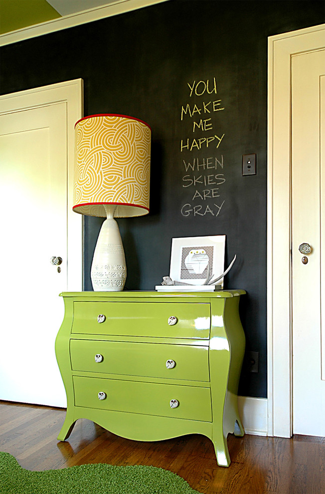 Photo of a transitional gender-neutral nursery in Orange County with black walls.