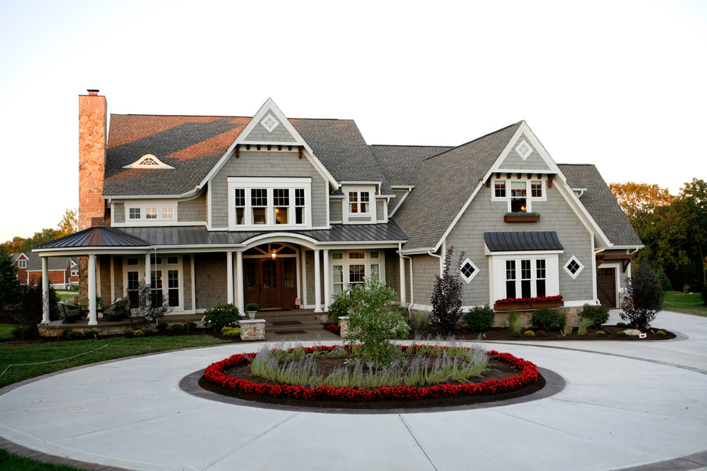 Photo of a traditional two-storey grey exterior in Indianapolis with wood siding and a mixed roof.