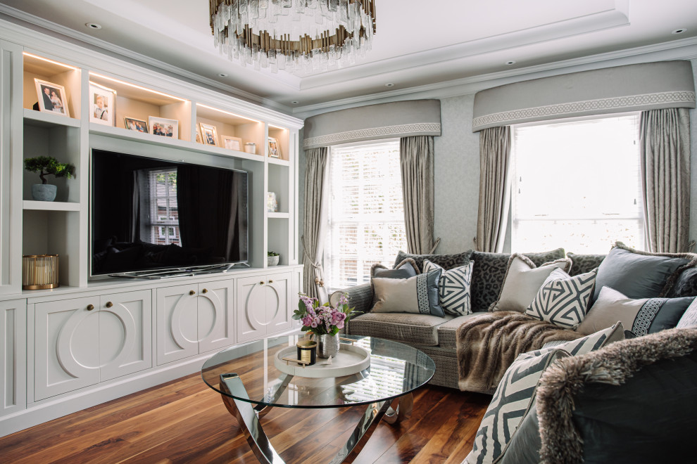 Large transitional formal living room in Belfast with grey walls, dark hardwood floors, a built-in media wall, brown floor, recessed and decorative wall panelling.