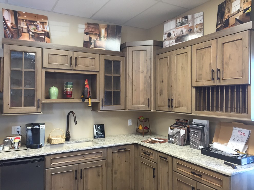Example of a small transitional l-shaped kitchen design with flat-panel cabinets