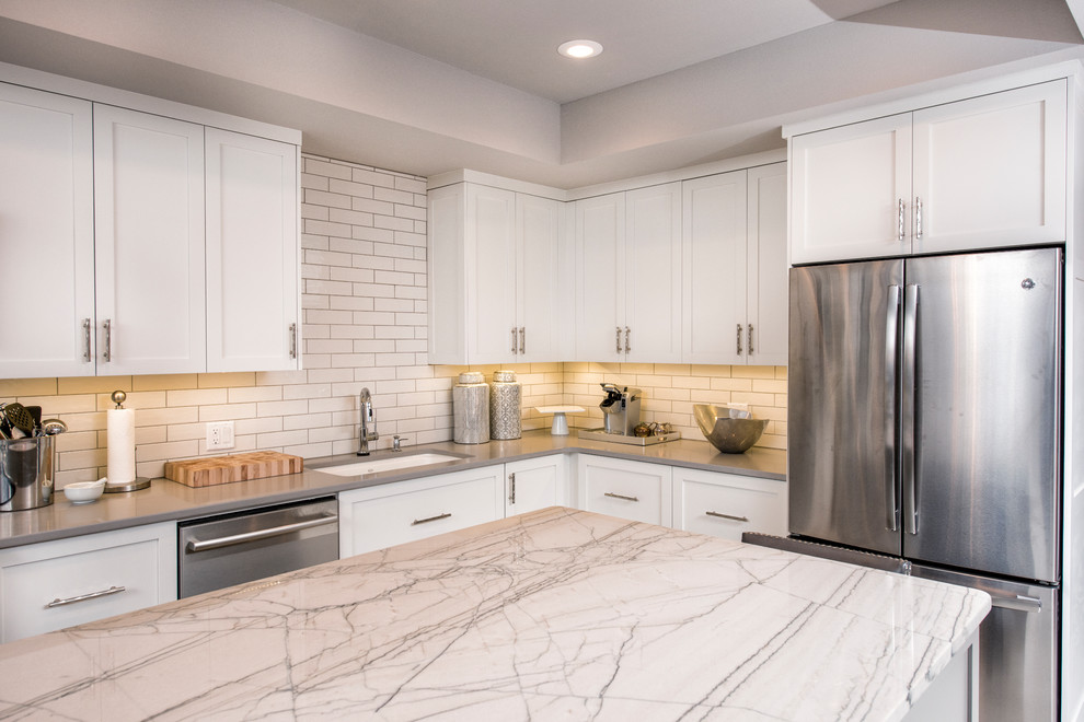 Eat-in kitchen - mid-sized transitional l-shaped eat-in kitchen idea with flat-panel cabinets, white cabinets and an island