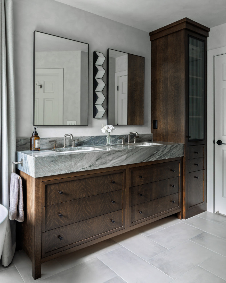 Inspiration for a transitional gray floor and double-sink bathroom remodel in Minneapolis with recessed-panel cabinets, dark wood cabinets, gray walls, an undermount sink, gray countertops and a built-in vanity