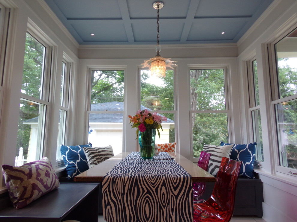 Example of a large transitional u-shaped porcelain tile eat-in kitchen design with a farmhouse sink, flat-panel cabinets, gray cabinets, marble countertops, white backsplash, ceramic backsplash, white appliances and no island