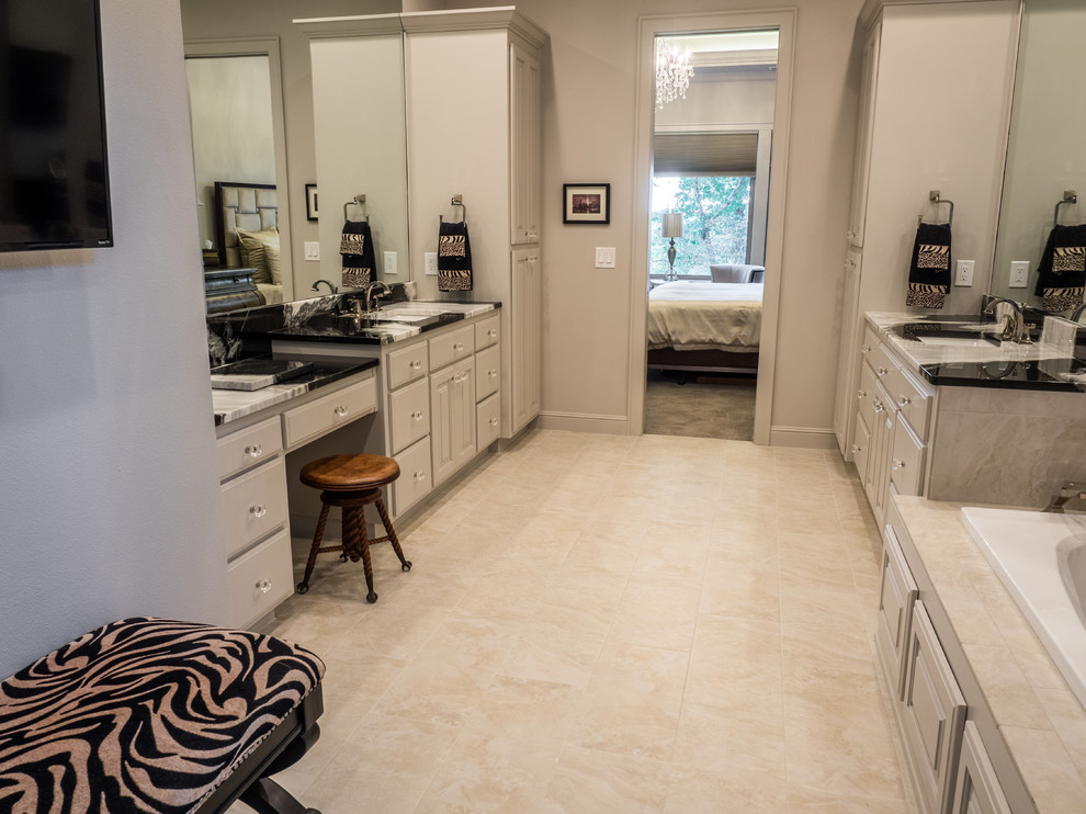 Example of a large transitional master bathroom design with raised-panel cabinets, white cabinets, a wall-mount sink and marble countertops