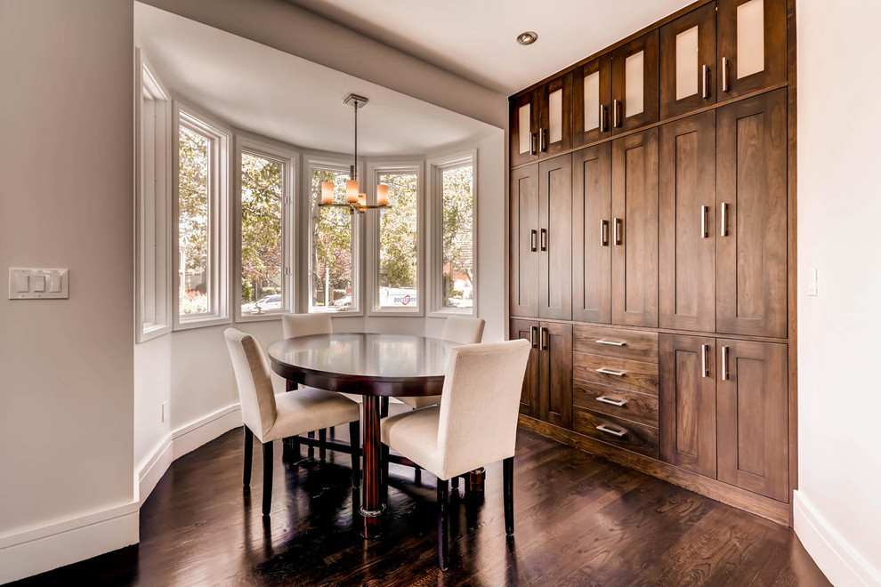 Example of a large transitional dark wood floor eat-in kitchen design in Denver with an undermount sink, shaker cabinets, dark wood cabinets, quartz countertops, stainless steel appliances and two islands