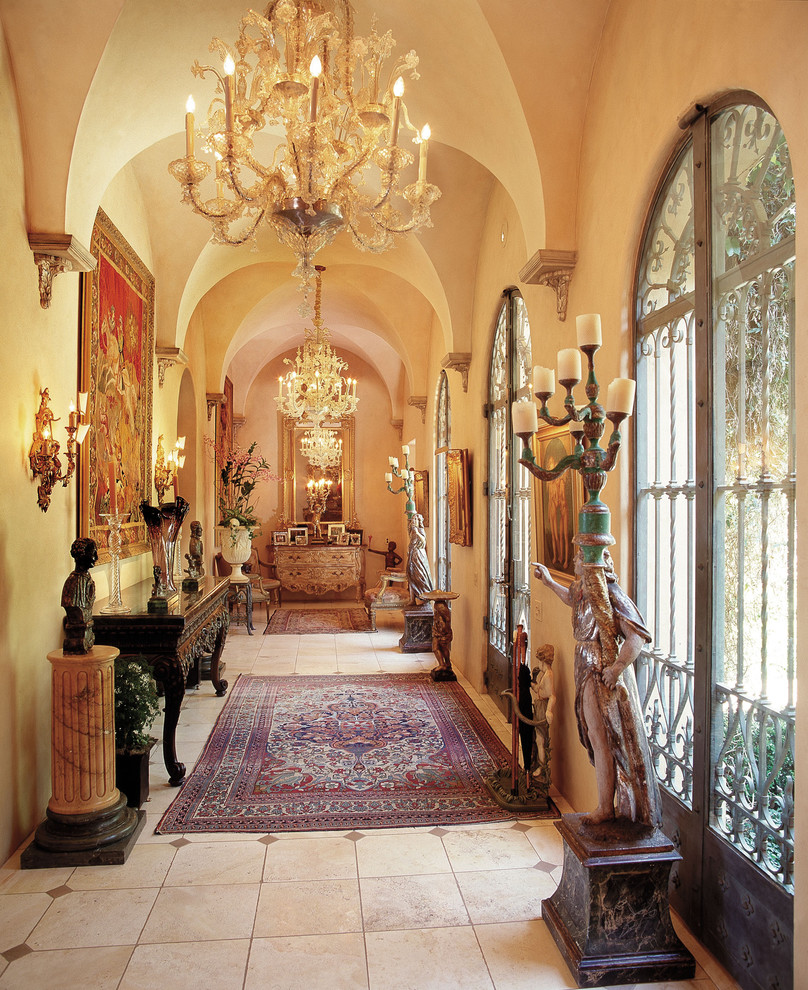 Traditional entry hall in Los Angeles with yellow walls.
