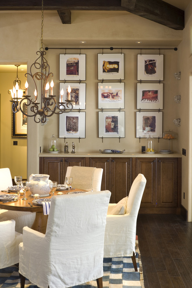 Photo of a country dining room in Portland with beige walls and dark hardwood floors.
