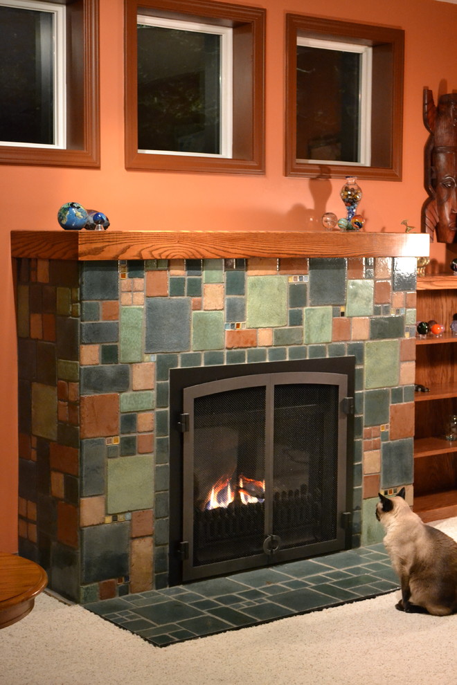 This is an example of an arts and crafts living room in New York with ceramic floors and a tile fireplace surround.