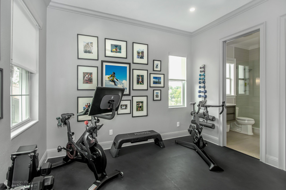 This is an example of a small modern multipurpose gym in Tampa with grey walls and black floor.